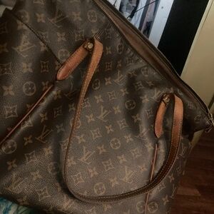 Louis Vuitton repaired pursr